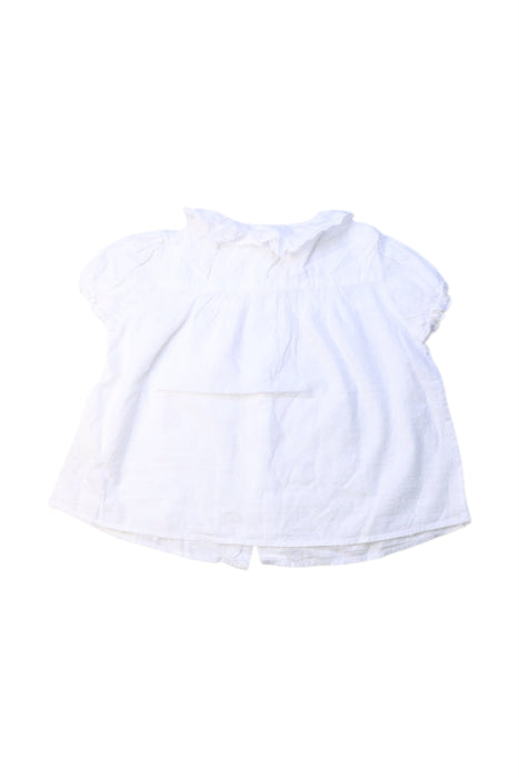 A White Short Sleeve Shirts from Nanos in size 12-18M for girl. (Back View)