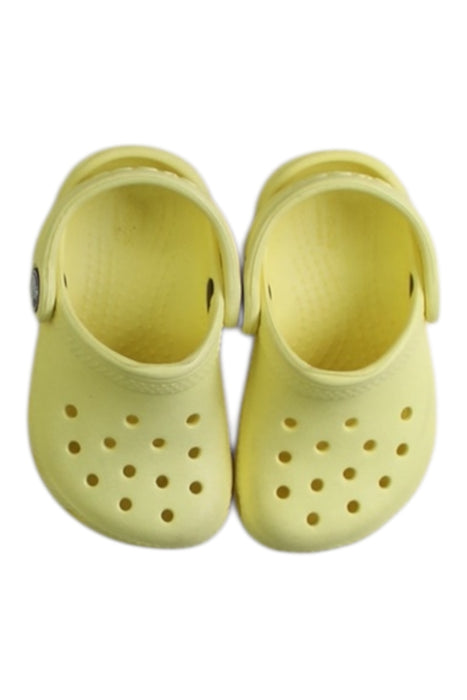 A Yellow Slip Ons from Crocs in size 12-18M for neutral. (Back View)