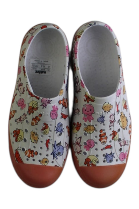 A White Slip Ons from Native Shoes in size 7Y for neutral. (Back View)