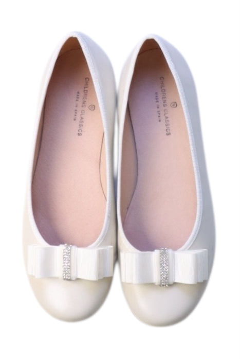 A White Flats from Childrens Classics in size 10Y for girl. (Back View)
