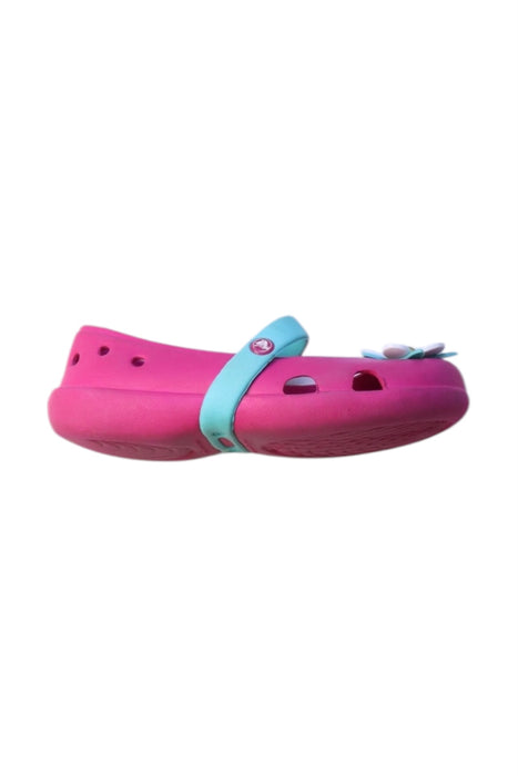 A Pink Slip Ons from Crocs in size 3T for girl. (Front View)