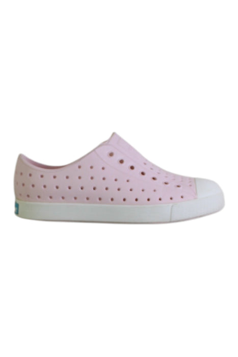 A Pink Slip Ons from Native Shoes in size 7Y for girl. (Front View)