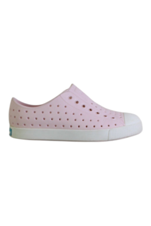 A Pink Slip Ons from Native Shoes in size 7Y for girl. (Front View)
