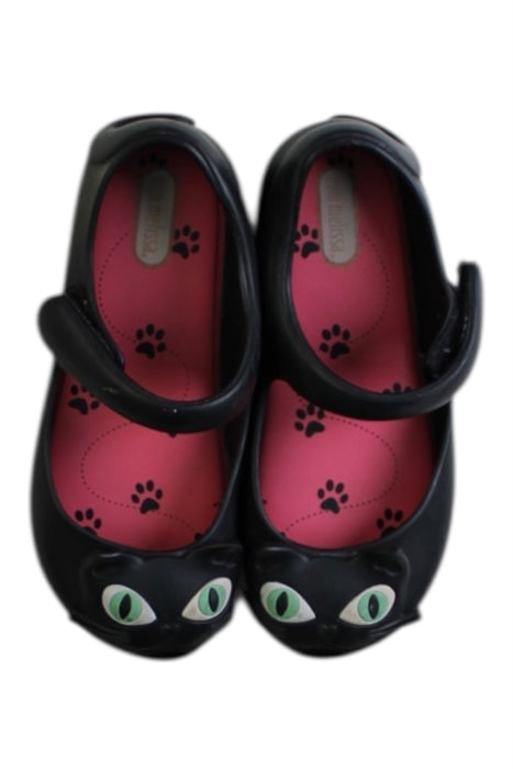 A Black Flats from Mini Melissa in size 4T for girl. (Back View)