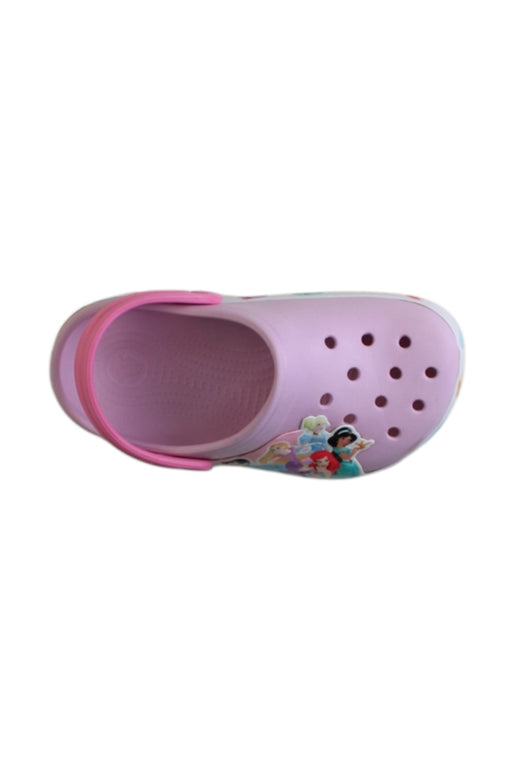 A Pink Slip Ons from Crocs in size 7Y for girl. (Front View)