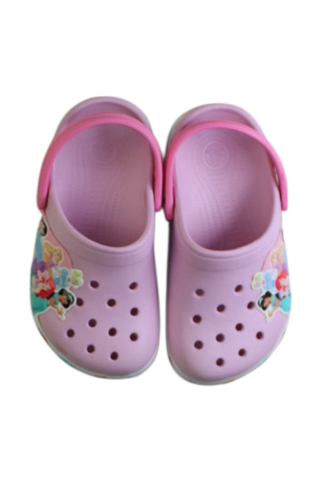 A Pink Slip Ons from Crocs in size 7Y for girl. (Back View)