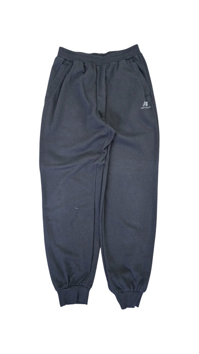 A Black Sweatpants from New Balance in size 14Y for neutral. (Front View)