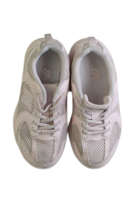 A White Sneakers from New Balance in size 5T for girl. (Back View)