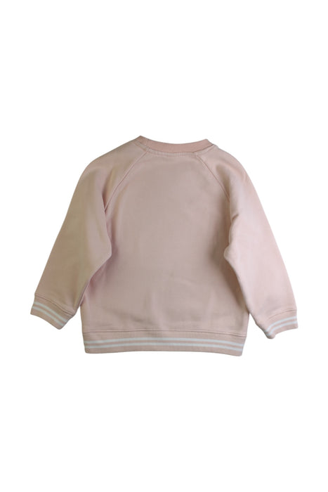 A Pink Crewneck Sweatshirts from Petit Bateau in size 5T for girl. (Back View)