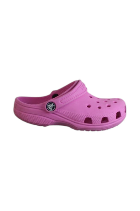 A Pink Slip Ons from Crocs in size 5T for girl. (Front View)