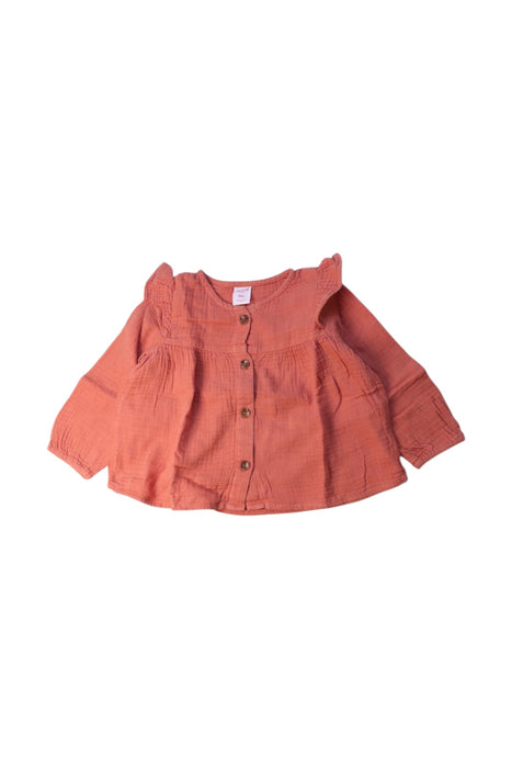 A Orange Long Sleeve Tops from Seed in size 12-18M for girl. (Front View)
