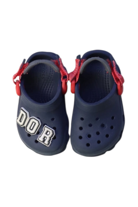 A Navy Slip Ons from Crocs in size 18-24M for boy. (Back View)
