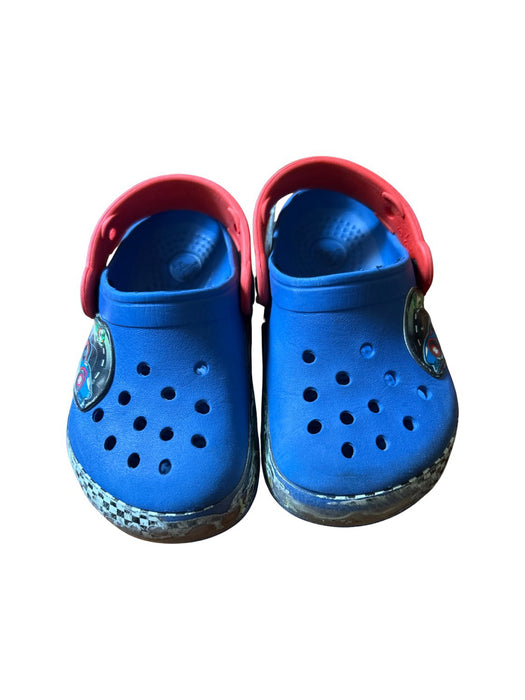 A Blue Slip Ons from Crocs in size 4T for boy. (Front View)