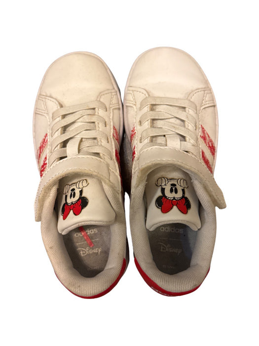 A White Sneakers from Adidas in size 5T for girl. (Front View)