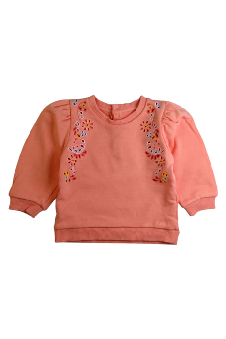 A Peach Crewneck Sweatshirts from Chloe in size 6-12M for girl. (Front View)