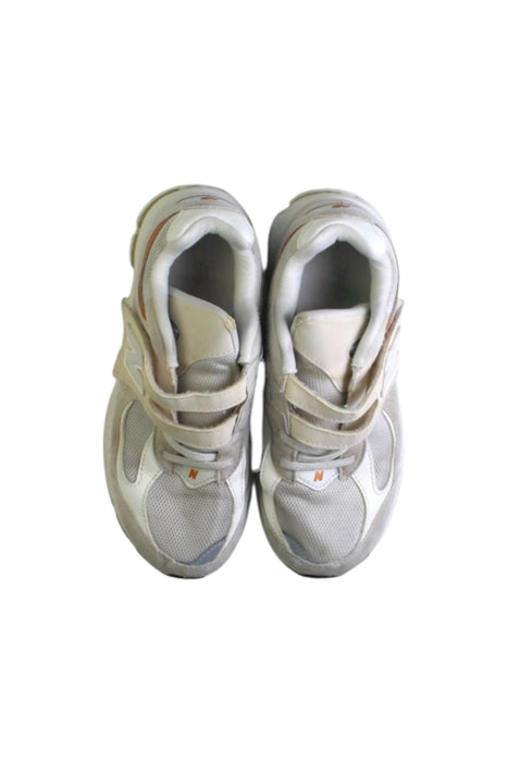 A White Sneakers from New Balance in size 10Y for boy. (Back View)