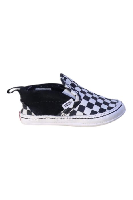 A Black Slip Ons from Vans in size 12-18M for neutral. (Front View)