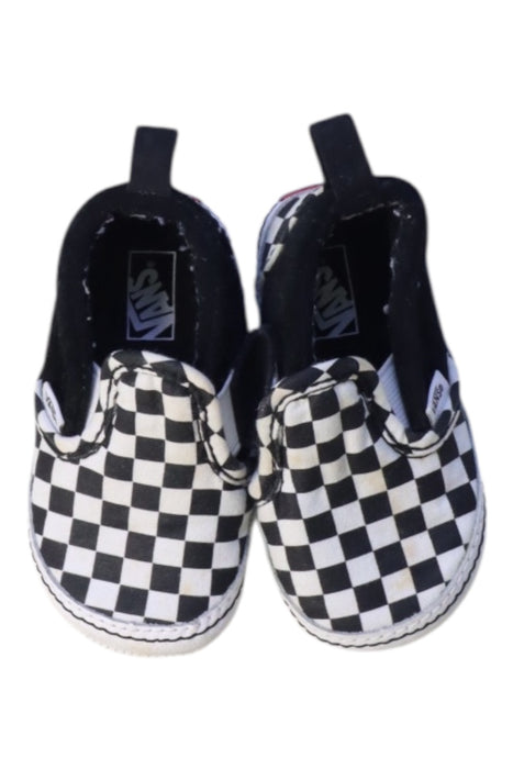 A Black Slip Ons from Vans in size 12-18M for neutral. (Back View)