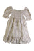 A Beige Short Sleeve Dresses from Nothing Fits But in size 12-18M for girl. (Front View)
