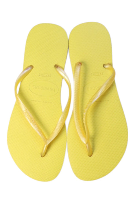 A Yellow Flip Flops from Havaianas in size 13Y for girl. (Back View)