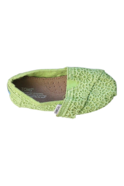 A Green Slip Ons from Toms in size 18-24M for girl. (Front View)