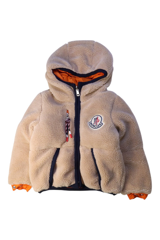 A Beige Puffer/Quilted Jackets from Moncler in size 6-12M for neutral. (Front View)