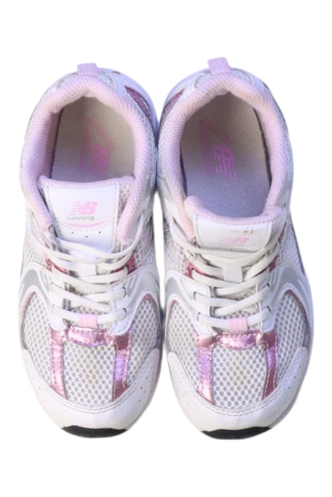 A White Sneakers from New Balance in size 7Y for girl. (Back View)