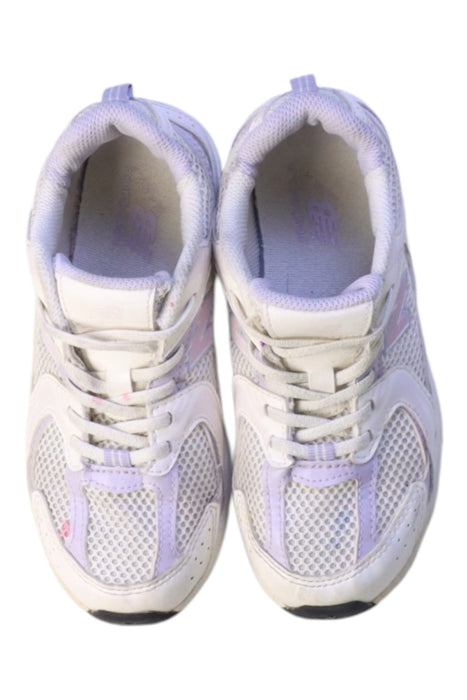 A White Sneakers from New Balance in size 7Y for girl. (Back View)