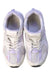 A White Sneakers from New Balance in size 7Y for girl. (Back View)
