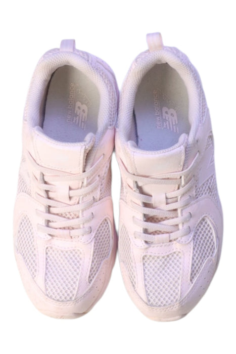 A White Sneakers from New Balance in size 7Y for girl. (Back View)