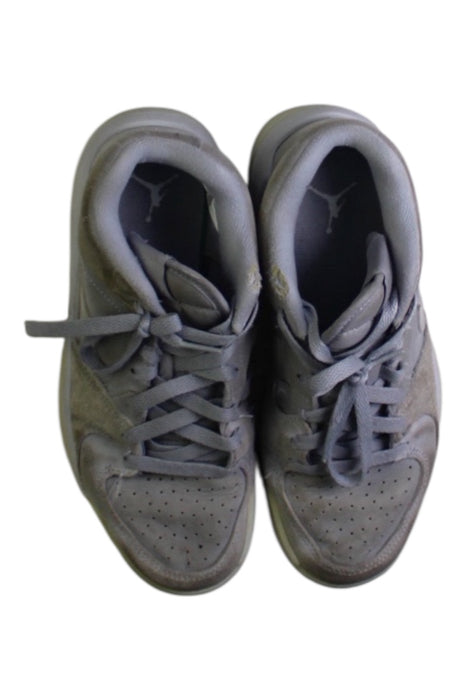 A Grey Sneakers from Air Jordan in size 11Y for boy. (Back View)