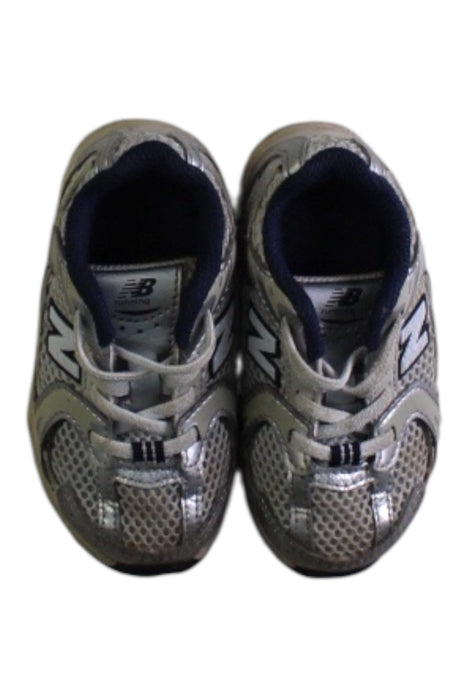 A Silver Sneakers from New Balance in size 18-24M for boy. (Back View)