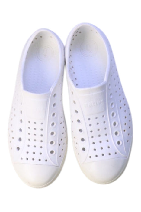 A White Sneakers from Native Shoes in size 11Y for boy. (Back View)