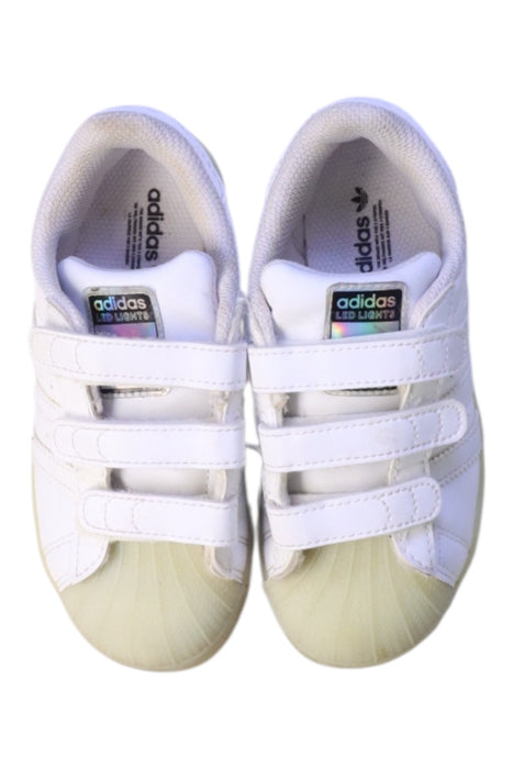 A White Sneakers from Adidas in size 5T for boy. (Back View)