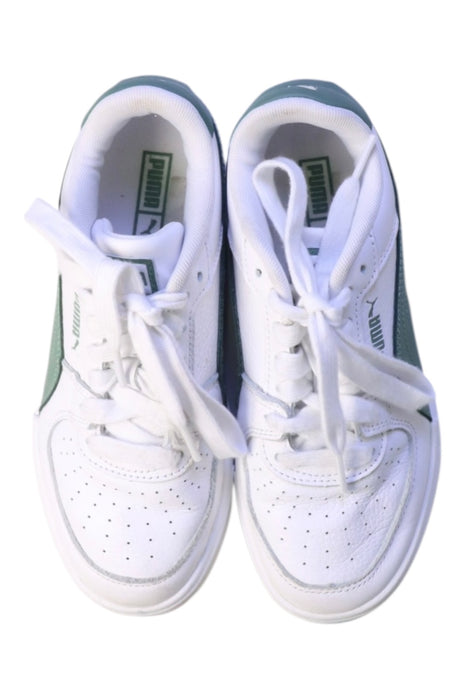 A White Sneakers from Puma in size 11Y for girl. (Back View)