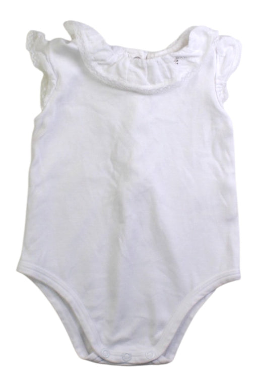 A White Sleeveless Bodysuits from Nanos in size 3-6M for girl. (Front View)