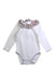 A White Long Sleeve Bodysuits from La Coqueta in size 3-6M for girl. (Front View)