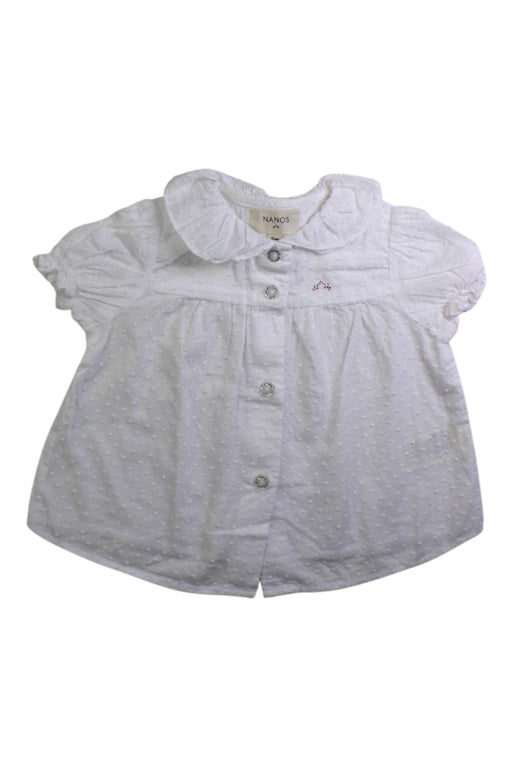 A White Short Sleeve Tops from Nanos in size 3-6M for girl. (Front View)