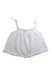 A White Sleeveless Tops from Nanos in size 6-12M for girl. (Front View)