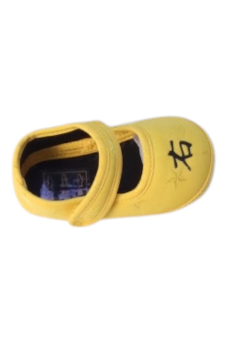 A Yellow Flats from Shanghai Tang in size 6-12M for neutral. (Front View)