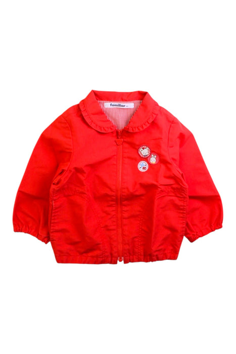 A Red Lightweight Jackets from Familiar in size 12-18M for girl. (Front View)