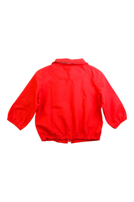 A Red Lightweight Jackets from Familiar in size 12-18M for girl. (Back View)