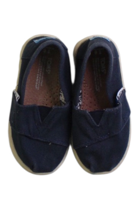 A Navy Slip Ons from Toms in size 18-24M for boy. (Back View)