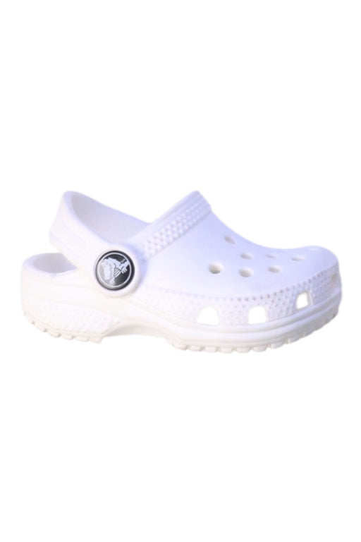 A White Slip Ons from Crocs in size 12-18M for neutral. (Front View)