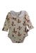 A Ivory Long Sleeve Bodysuits from Milkbarn in size 6-12M for girl. (Front View)