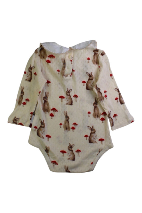 A Ivory Long Sleeve Bodysuits from Milkbarn in size 6-12M for girl. (Back View)
