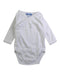 A White Long Sleeve Bodysuits from Jacadi in size Newborn for girl. (Front View)