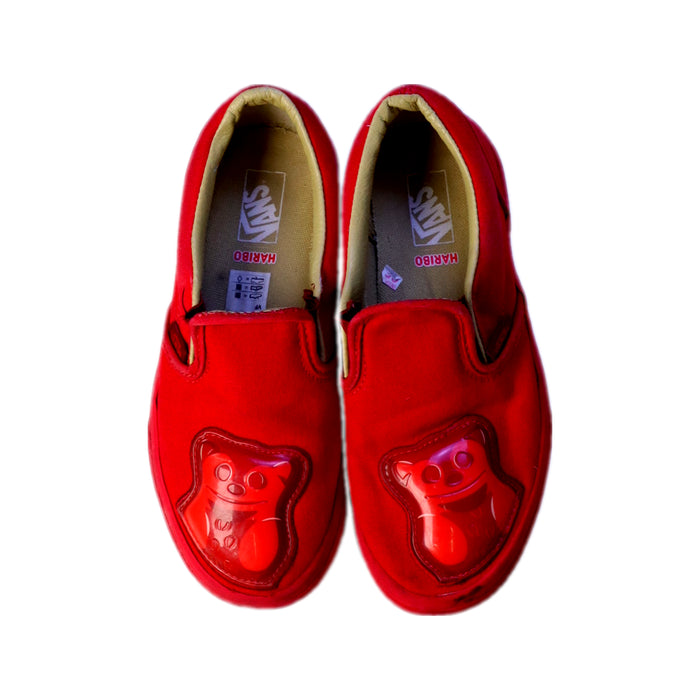 A Red Slip Ons from Vans in size 7Y for neutral. (Back View)