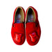A Red Slip Ons from Vans in size 7Y for neutral. (Back View)