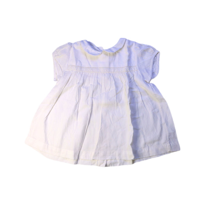 A White Short Sleeve Dresses from Little Cotton Clothes in size 5T for girl. (Front View)